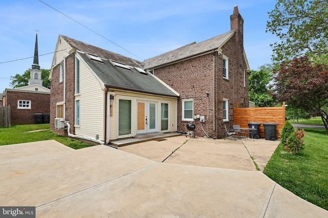 4102 N W St, Wilmington, DE 19802 - rear view of property featuring a patio area, a chimney, and brick siding