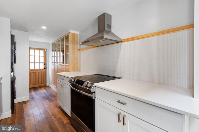 4102 N W St, Wilmington, DE 19802 - kitchen with island range hood, stainless steel electric range, tasteful backsplash, dark wood-type flooring, and recessed lighting