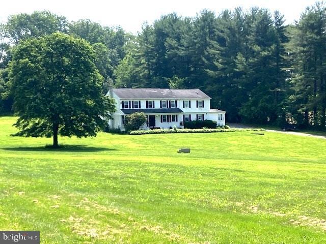 3243 Niner Rd, Finksburg, MD 21048 - colonial house with a front lawn and a wooded view