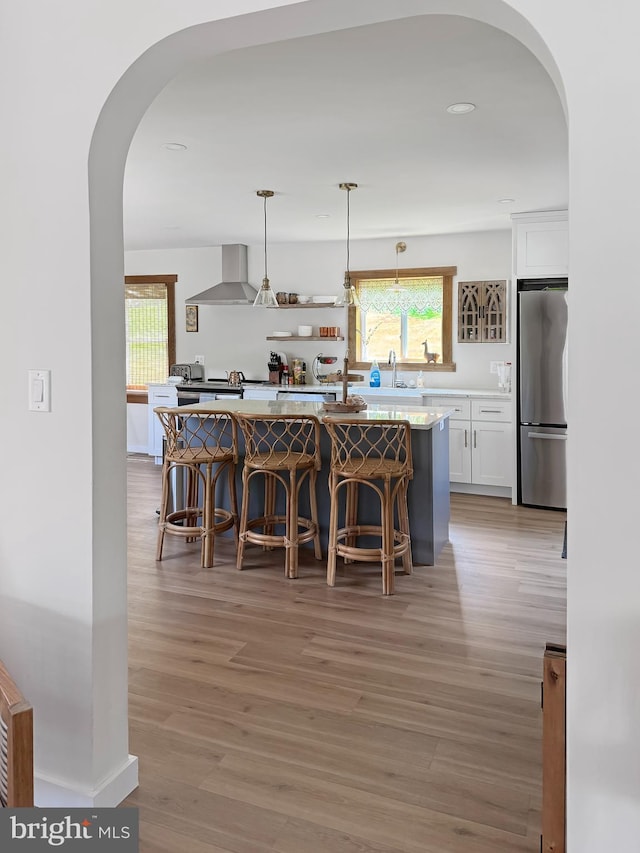 680 Myers Rd, Muncy Valley, PA 17758 - dining space with arched walkways, light wood finished floors, and recessed lighting