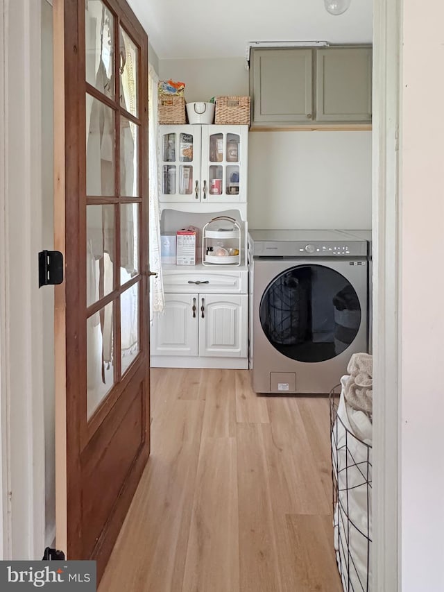 680 Myers Rd, Muncy Valley, PA 17758 - laundry area with washer / clothes dryer, cabinet space, and light wood finished floors