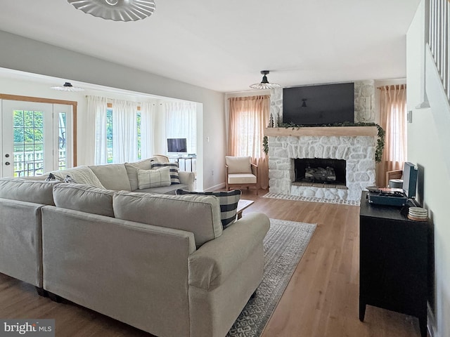 680 Myers Rd, Muncy Valley, PA 17758 - living room featuring a stone fireplace and wood finished floors