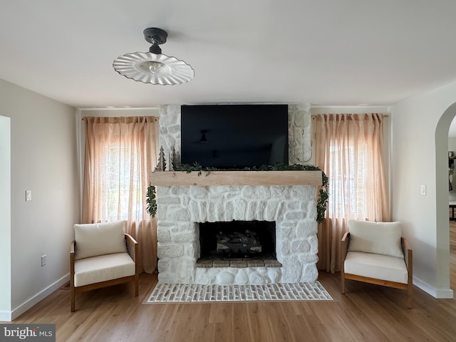 680 Myers Rd, Muncy Valley, PA 17758 - living area featuring arched walkways, wood finished floors, and plenty of natural light