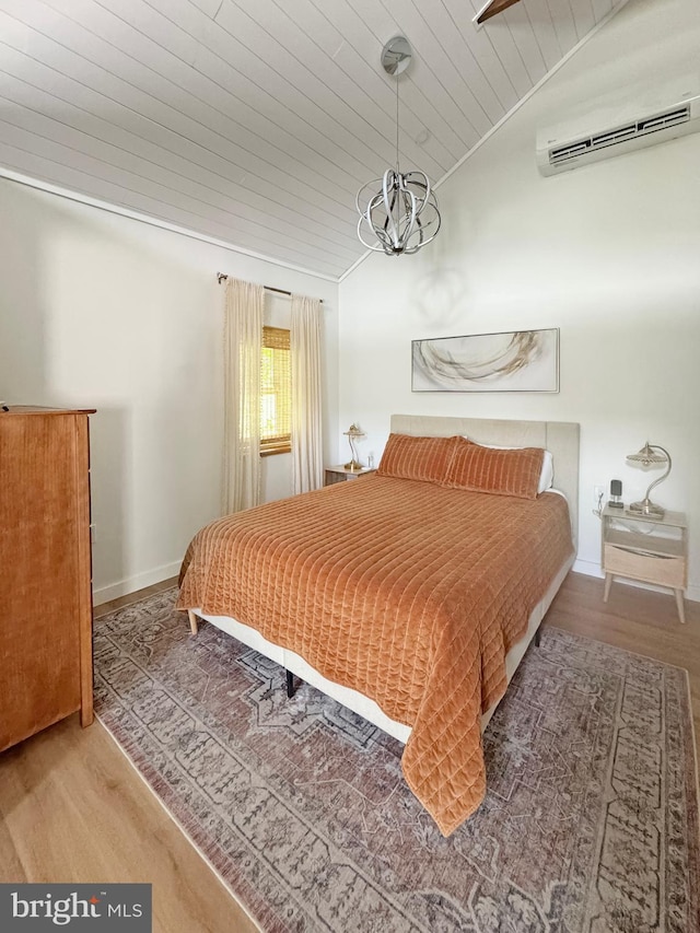 680 Myers Rd, Muncy Valley, PA 17758 - bedroom with a wall mounted air conditioner, wood ceiling, wood finished floors, lofted ceiling, and a chandelier