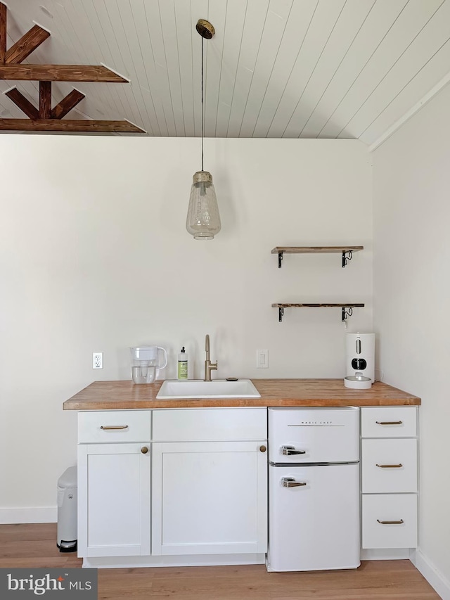 680 Myers Rd, Muncy Valley, PA 17758 - bar area featuring wooden ceiling, light wood-type flooring, dishwashing machine, and freestanding refrigerator