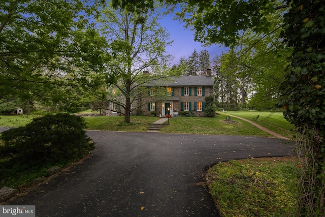 2622 Butler Pike, Plymouth Meeting, PA 19462 - colonial inspired home with a chimney, a front yard, asphalt driveway, and brick siding