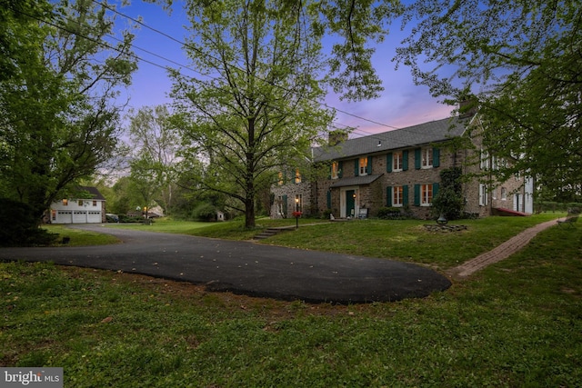 2622 Butler Pike, Plymouth Meeting, PA 19462 - colonial house with a front lawn, a garage, and brick siding