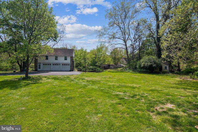 2622 Butler Pike, Plymouth Meeting, PA 19462 - view of green lawn featuring driveway and an attached garage