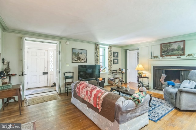 2622 Butler Pike, Plymouth Meeting, PA 19462 - living area with ornamental molding, a fireplace with flush hearth, and wood finished floors