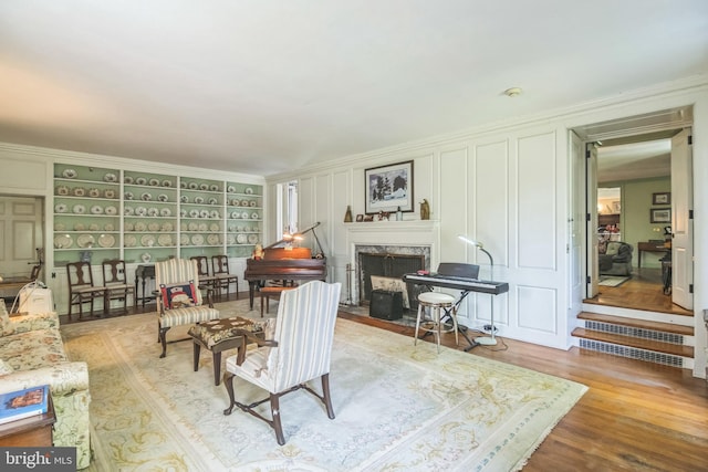 2622 Butler Pike, Plymouth Meeting, PA 19462 - living room featuring wood finished floors, a high end fireplace, and ornamental molding
