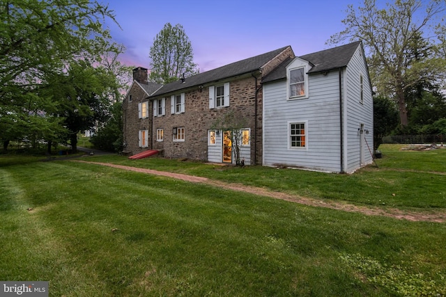 2622 Butler Pike, Plymouth Meeting, PA 19462 - view of front of home featuring a chimney, a lawn, and a shingled roof