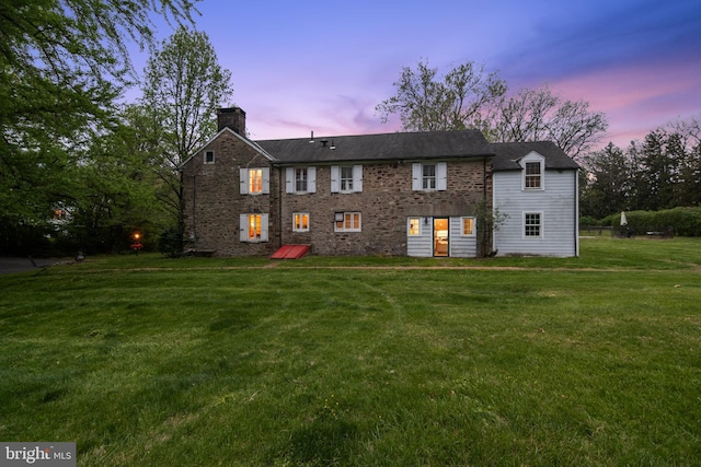 2622 Butler Pike, Plymouth Meeting, PA 19462 - rear view of property featuring a chimney and a lawn
