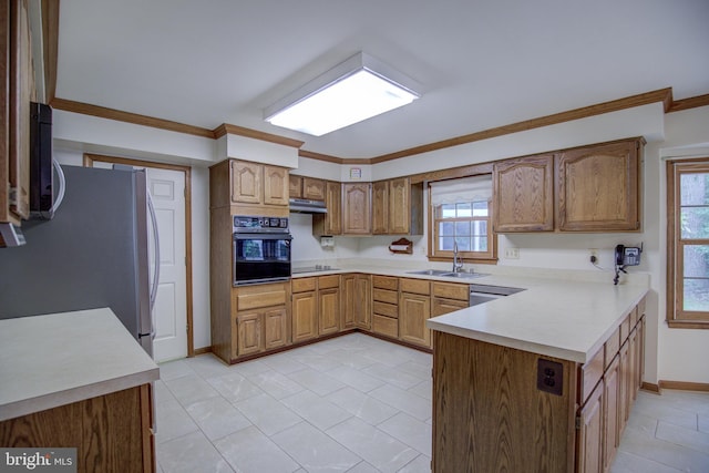 9708 S Park Cir, Fairfax Station, VA 22039 - kitchen with black appliances, a peninsula, under cabinet range hood, light countertops, and ornamental molding
