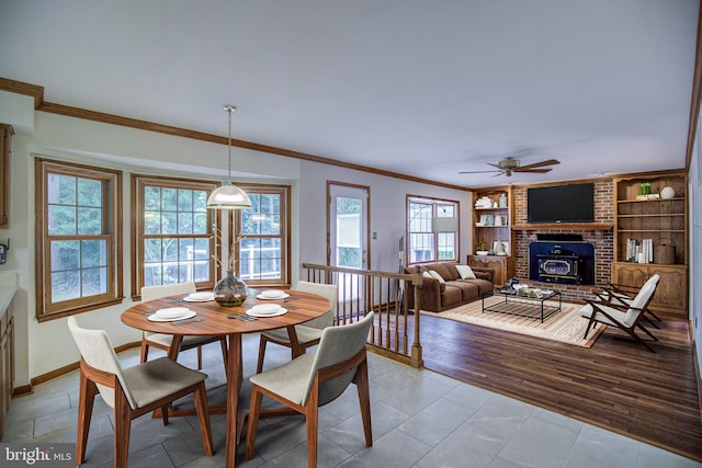 9708 S Park Cir, Fairfax Station, VA 22039 - dining area featuring ornamental molding, a ceiling fan, built in features, a brick fireplace, and light tile patterned flooring