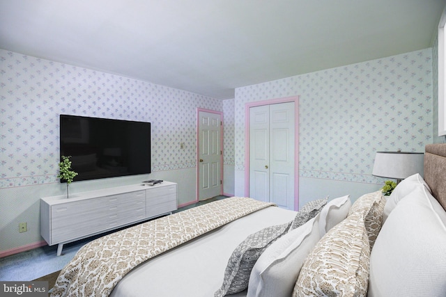 9708 S Park Cir, Fairfax Station, VA 22039 - bedroom with wallpapered walls, a closet, and carpet flooring