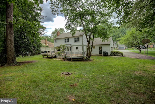 9708 S Park Cir, Fairfax Station, VA 22039 - rear view of property featuring a yard, a wooden deck, and a chimney