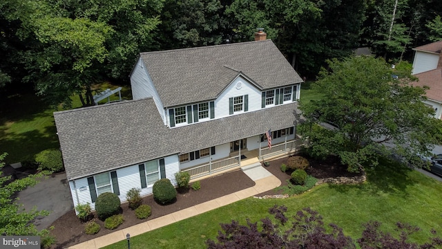 9708 S Park Cir, Fairfax Station, VA 22039 - view of front of property with a shingled roof, a porch, a front lawn, and a chimney