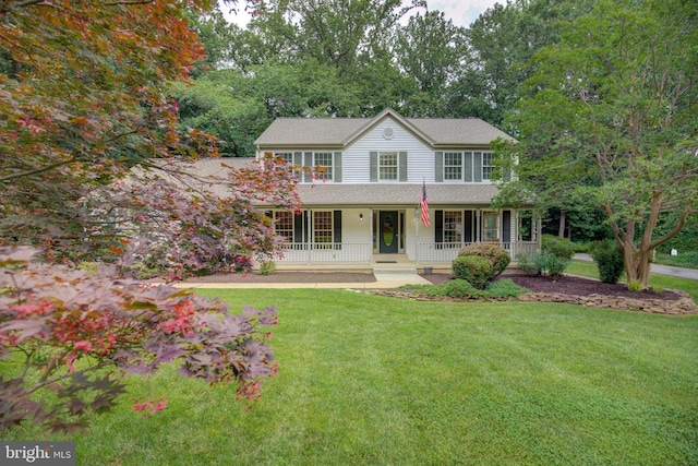 9708 S Park Cir, Fairfax Station, VA 22039 - colonial-style house featuring a porch, a front lawn, and a shingled roof