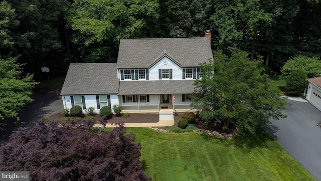 9708 S Park Cir, Fairfax Station, VA 22039 - view of front facade featuring covered porch, a chimney, a shingled roof, and a front lawn