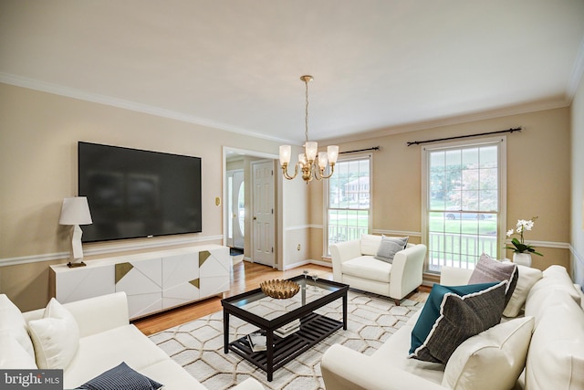 9708 S Park Cir, Fairfax Station, VA 22039 - living room featuring a chandelier, ornamental molding, and light wood-type flooring