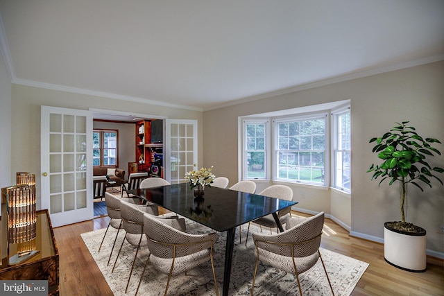9708 S Park Cir, Fairfax Station, VA 22039 - dining space featuring crown molding, french doors, and light wood-style flooring