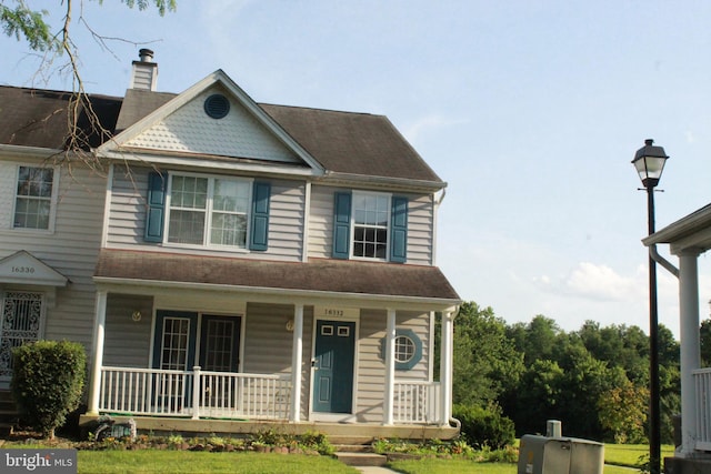 16332 Brooktrail Ct, Upper Marlboro, MD 20772 - view of front of property featuring covered porch, a chimney, and a front lawn