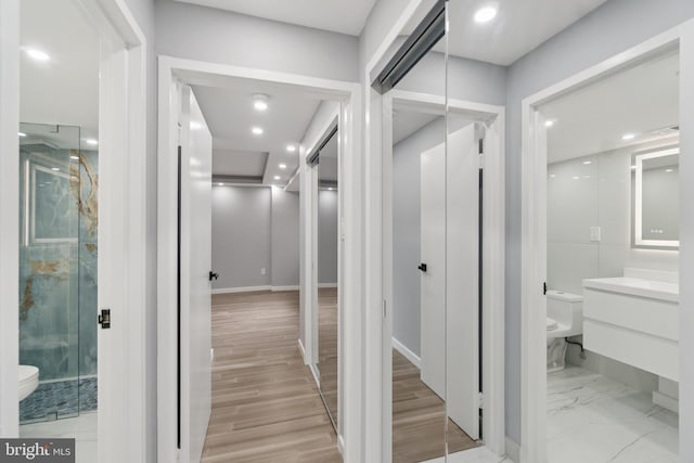 4201 Cathedral Ave NW Unit 122E, Washington, DC 20016 - hall with light wood finished floors and recessed lighting