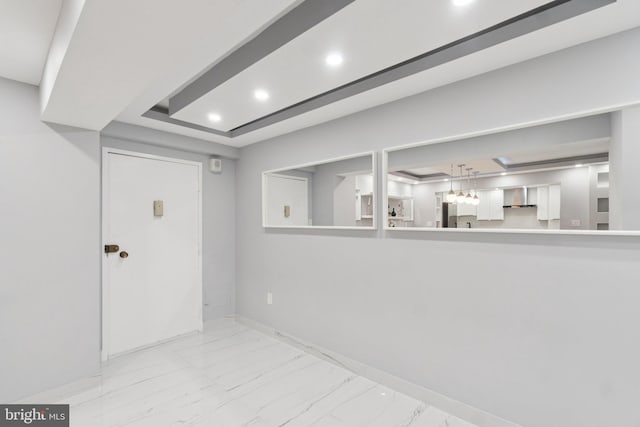 4201 Cathedral Ave NW Unit 122E, Washington, DC 20016 - basement with marble look tiles, recessed lighting, and fridge