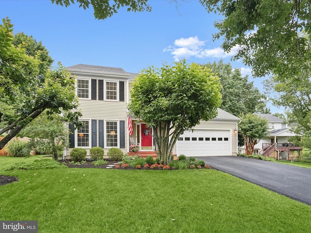 10267 Cedar Ridge Dr, Manassas, VA 20110 - view of front of property with driveway, an attached garage, and a front lawn