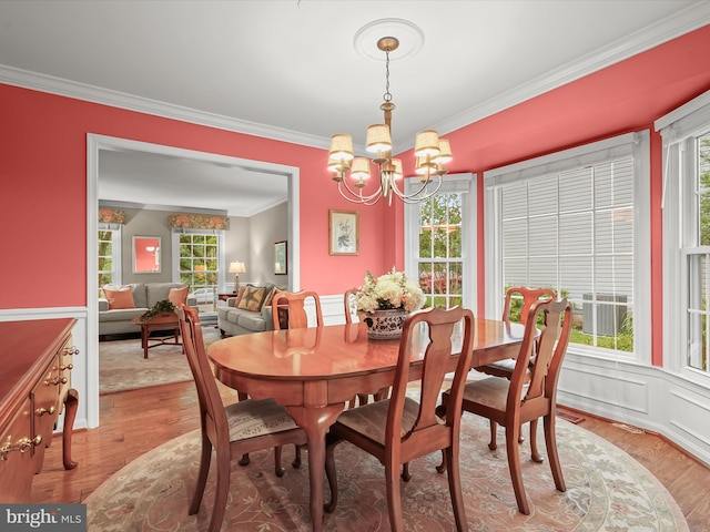 10267 Cedar Ridge Dr, Manassas, VA 20110 - dining space with crown molding, a chandelier, healthy amount of natural light, and light wood-style flooring