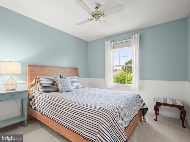 10267 Cedar Ridge Dr, Manassas, VA 20110 - bedroom with carpet floors, a wainscoted wall, and a ceiling fan