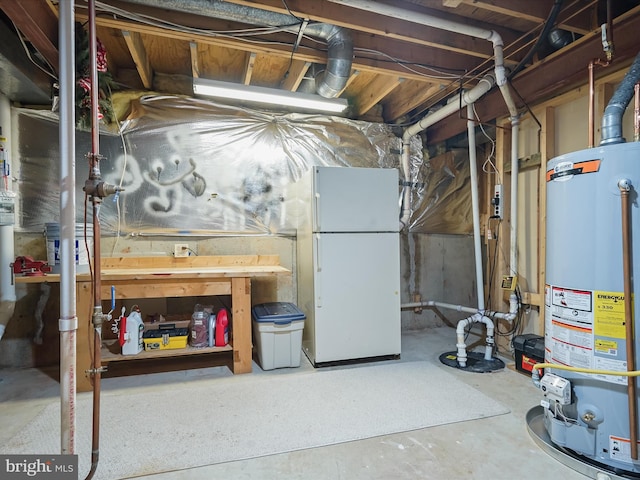 10267 Cedar Ridge Dr, Manassas, VA 20110 - unfinished below grade area with freestanding refrigerator and gas water heater