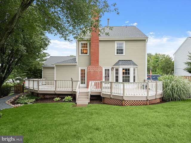 10267 Cedar Ridge Dr, Manassas, VA 20110 - back of property featuring a yard, roof with shingles, a chimney, and a wooden deck