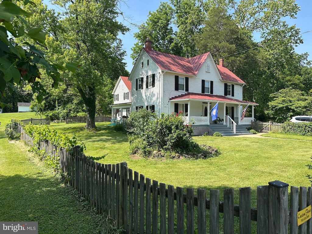 5128 Weston Rd, Warrenton, VA 20187 - farmhouse-style home with a porch, a chimney, a metal roof, and a fenced backyard