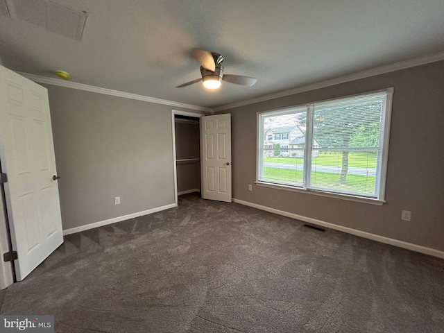 36697 W Club House Rd, Ocean View, DE 19970 - unfurnished bedroom featuring crown molding, dark carpet, a closet, and a ceiling fan