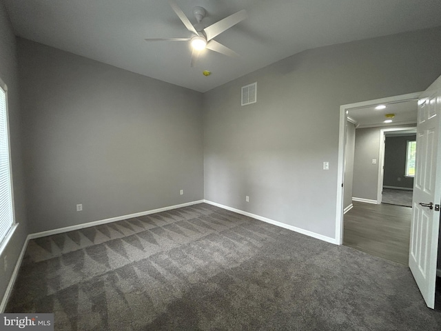 36697 W Club House Rd, Ocean View, DE 19970 - empty room featuring ceiling fan, dark carpet, and lofted ceiling