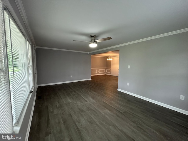 36697 W Club House Rd, Ocean View, DE 19970 - spare room featuring a chandelier, ceiling fan, ornamental molding, and dark wood finished floors