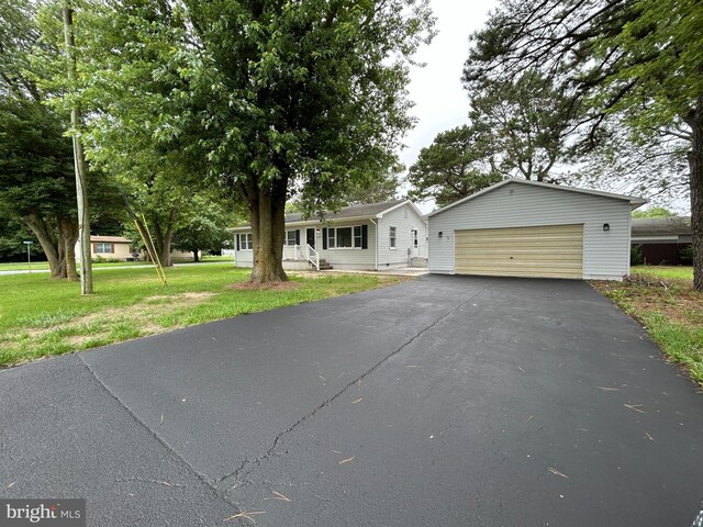 36697 W Club House Rd, Ocean View, DE 19970 - view of front of house with a front yard and a garage