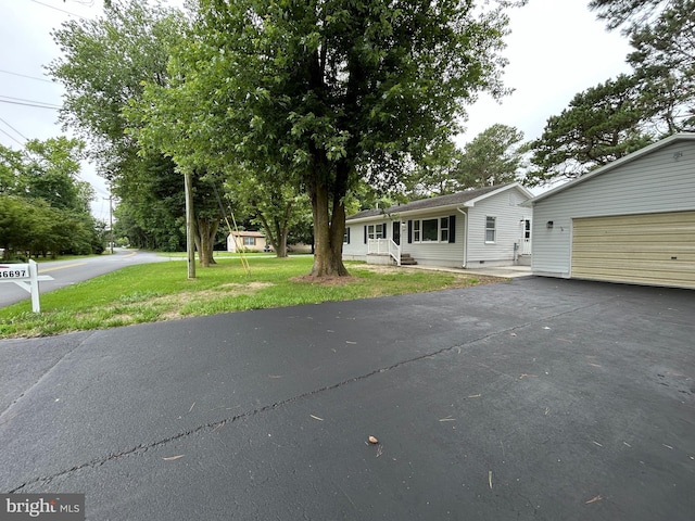 36697 W Club House Rd, Ocean View, DE 19970 - view of front of house featuring a front lawn and asphalt driveway