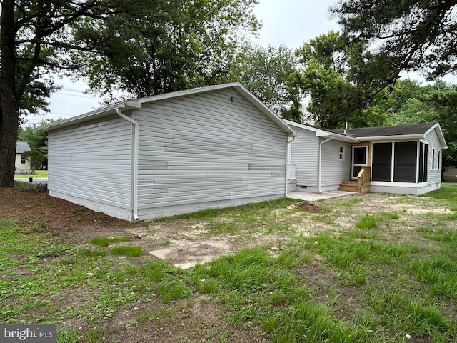 36697 W Club House Rd, Ocean View, DE 19970 - rear view of property with a sunroom and entry steps