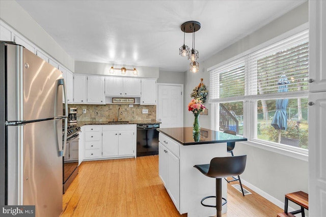 1752 Lark Ln, Cherry Hill, NJ 08003 - kitchen featuring freestanding refrigerator, dishwasher, range with electric stovetop, dark countertops, and white cabinets