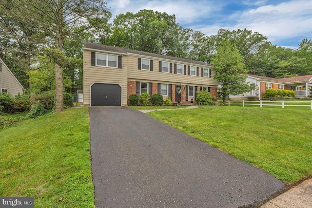 1752 Lark Ln, Cherry Hill, NJ 08003 - view of front of property featuring an attached garage, asphalt driveway, a front lawn, and brick siding