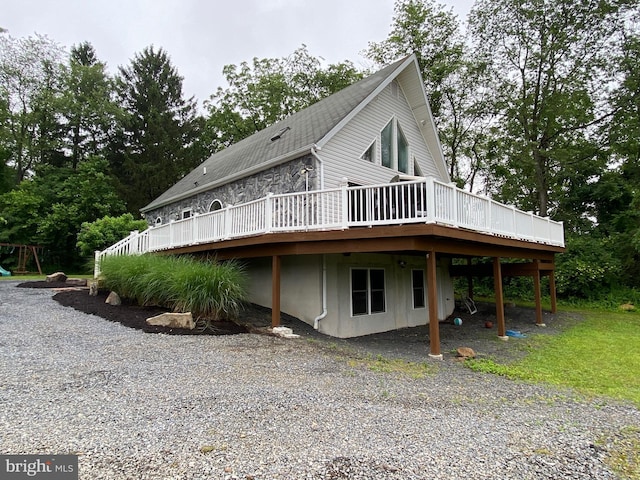 390 Summer Hill Rd, Schuylkill Haven, PA 17972 - view of home's exterior featuring a deck, gravel driveway, and view of scattered trees