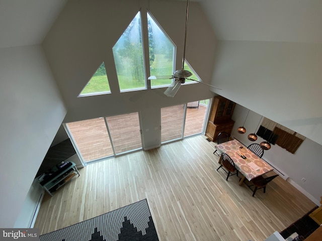 390 Summer Hill Rd, Schuylkill Haven, PA 17972 - living area with high vaulted ceiling, wood finished floors, healthy amount of natural light, and ceiling fan