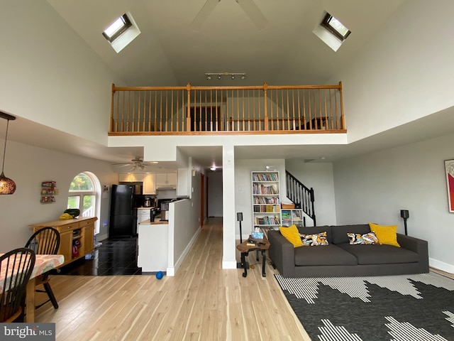 390 Summer Hill Rd, Schuylkill Haven, PA 17972 - living area with high vaulted ceiling, a ceiling fan, and light wood finished floors