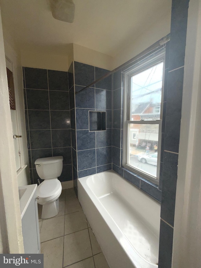 609 Bingaman St, Reading, PA 19602 - full bath featuring tile patterned flooring, a tub, vanity, and tile walls