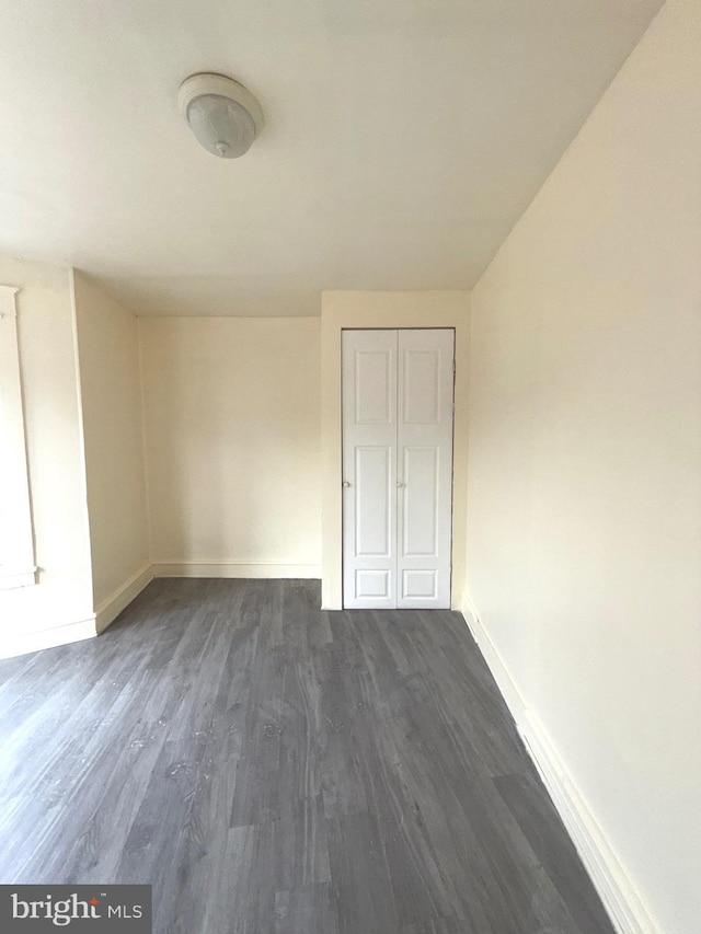 609 Bingaman St, Reading, PA 19602 - spare room with baseboards and dark wood-style floors