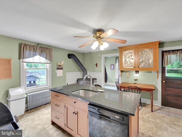 1989 Fair Rd, Schuylkill Haven, PA 17972 - kitchen featuring dishwasher, radiator heating unit, a center island with sink, ceiling fan, and dark stone countertops