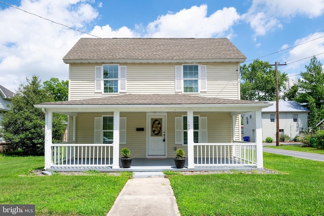 102 Walnut St, Bridgeville, DE 19933 - view of front facade with a porch, a front yard, and a shingled roof
