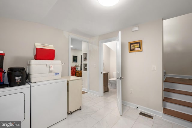 102 Walnut St, Bridgeville, DE 19933 - laundry area with baseboards and light marble finish floors